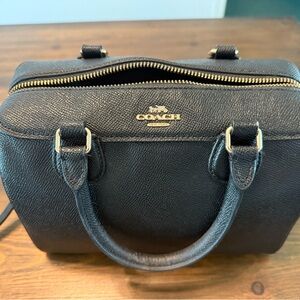 Coach Black Leather Satchel with Gold Accents along with a matching wallet.